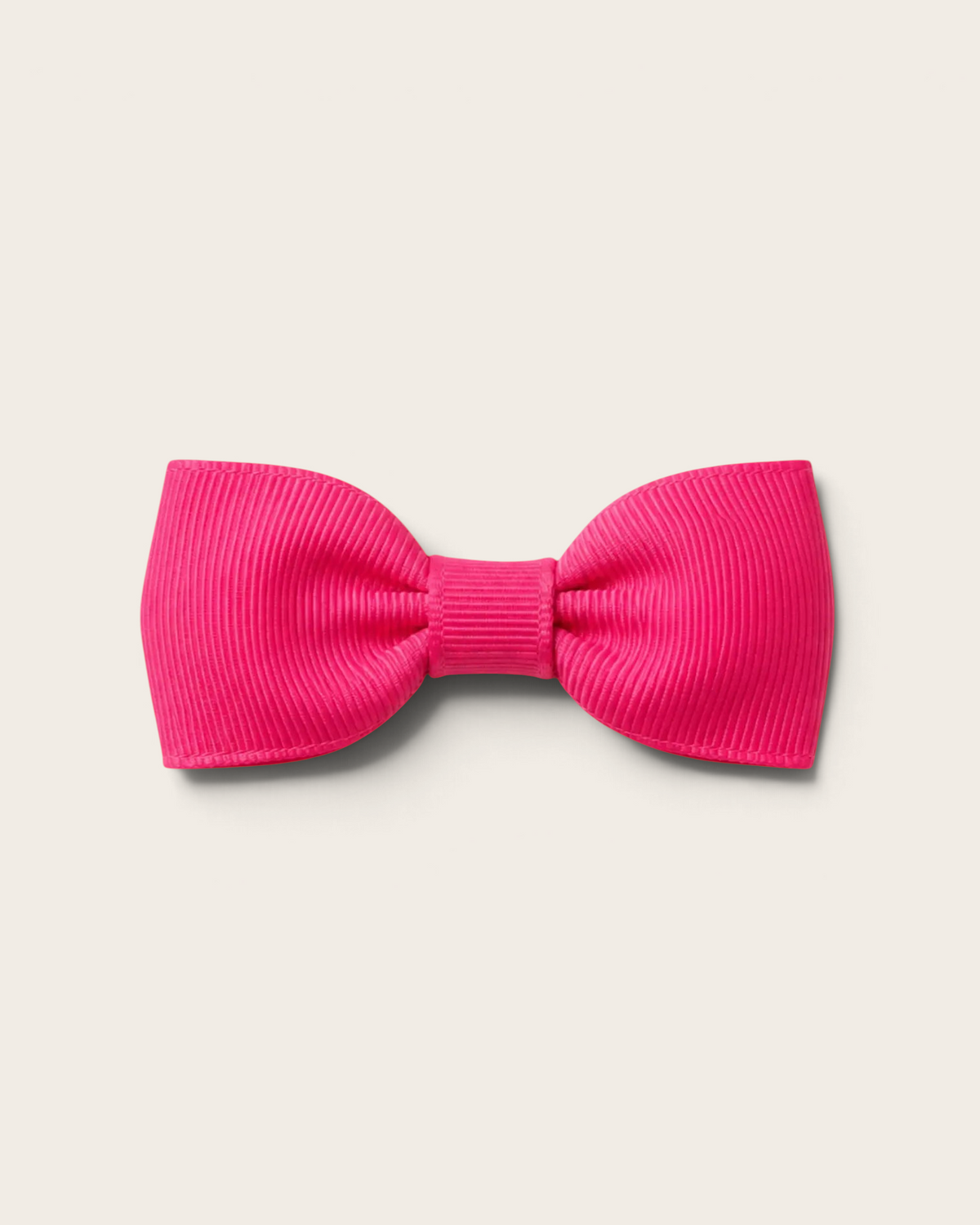 Liten hårrosett från Sprall i hot pink ripsband med praktisk metallklämma för barnhår.